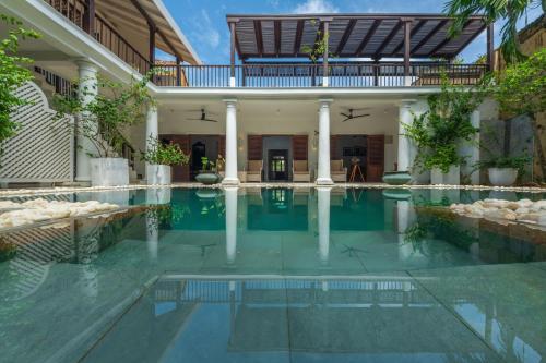 a swimming pool in a villa with a house at 32 Middle Street - 03 Bedrooms villa with private pool in Galle