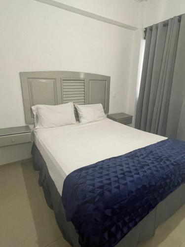 Postel nebo postele na pokoji v ubytování Gran Hotel Higuey