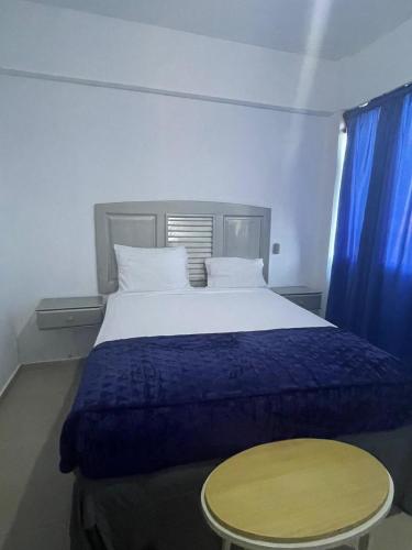 Postel nebo postele na pokoji v ubytování Gran Hotel Higuey