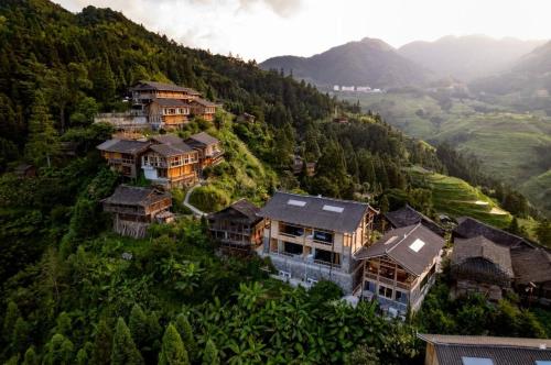 an aerial view of a house on a mountain at The Well House in Jiayi