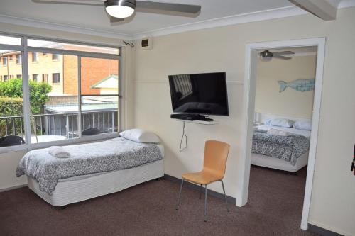 Postel nebo postele na pokoji v ubytování Wards Holiday Flat 5