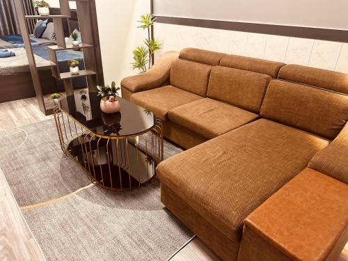 a living room with a couch and a table at Spring Home in Can Tho