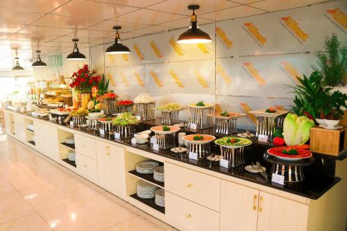 a buffet line with many plates of food at ELC Luxury Đà Lạt in Da Lat