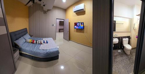 a hospital room with a bed and a sink at Bandar Alam Masai Staycation - Netflix, Unifi, Prime, Hotstar in Masai