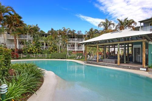 a swimming pool in front of a building at Noosa Resort & Spa in Noosaville