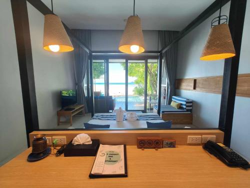 a room with a bedroom with a bed and a desk at Casa De Mar - Koh Samui in Chaweng