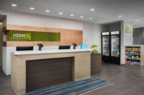 a lobby of a home store with a counter at Home2 Suites By Hilton Laredo North in Laredo