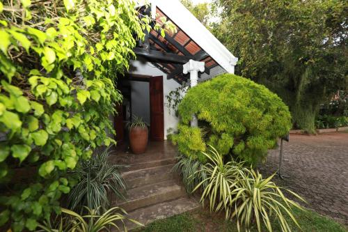 a small chapel with stairs leading to a door at Swanee Grand in Negombo