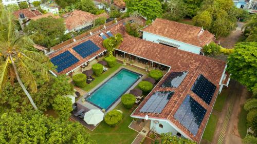 an overhead view of a house with a swimming pool at Swanee Grand in Negombo