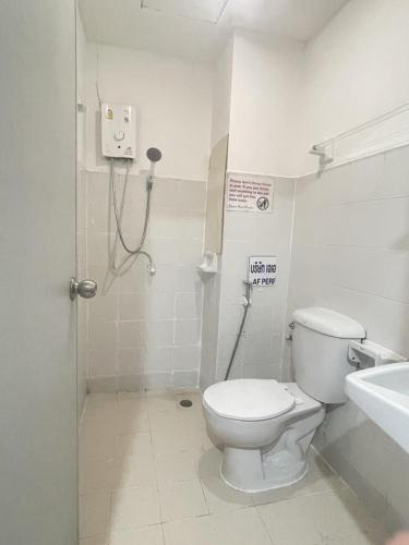 a bathroom with a toilet and a sink at Nice to CU Guest house in Patong Beach
