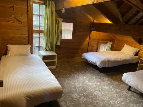 Katil atau katil-katil dalam bilik di White Hill Lodge Hakuba
