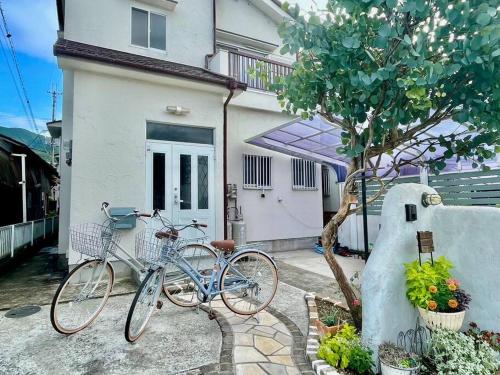 two bikes parked in front of a house at Only One Group! Koyasan 35min by Car, 2h by Train, Free Bikes, Walk to Station in Katsuragi