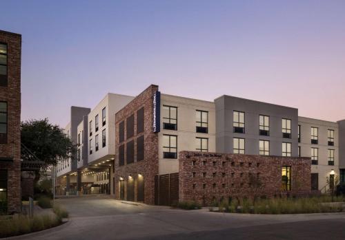 a rendering of the exterior of a building at Hampton by Hilton East Austin - near UT and Capitol in Austin