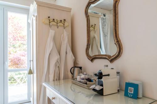 a bathroom with a counter and a mirror at Villa Valentina in Levanto