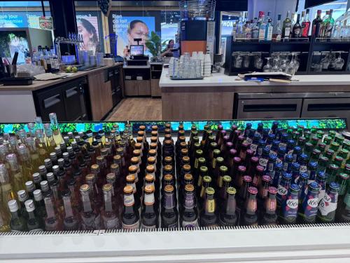 a display of bottles of beer in a store at Logement de Ville 4 chambres proche de Lille in Tourcoing