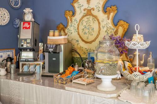 a table with a vase with a fish in it at Villa Valentina in Levanto