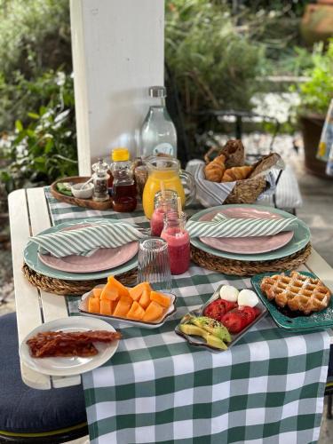 a table with plates of food on a table at Villa Valentina in Levanto