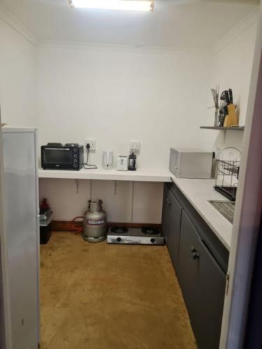 a kitchen with a sink and a counter top at Villa Tarentaal in Tulbagh