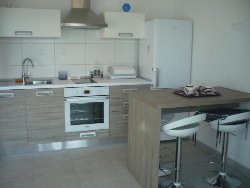 Kuchyň nebo kuchyňský kout v ubytování Apartments Mirela