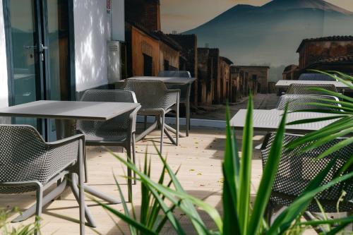 a row of tables and chairs on a patio at Il Tesoro Pompeiano in Pompei