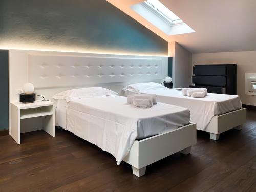 A bed or beds in a room at Le Stanze di Gianmarmo - Via di Mezzo
