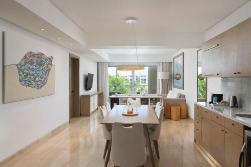 a kitchen and dining room with a table and chairs at Paradisus Grand Cana, All Suites - Punta Cana -All Inclusive in Punta Cana