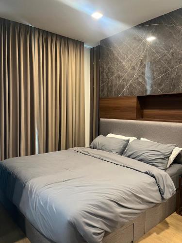 a bedroom with a large bed in a room at A303Forestkhaoyai in Ban Huai Sok Noi