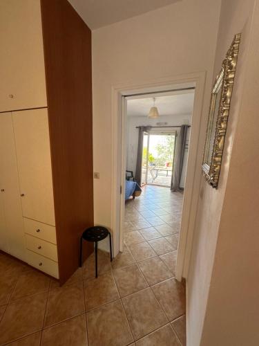 a hallway with a door leading to a living room at Seapine Studios in Lassi