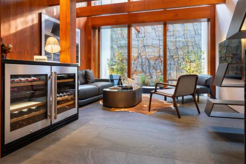 a living room with a couch and a fireplace at Miya Townhouse by Reflections in Kyoto