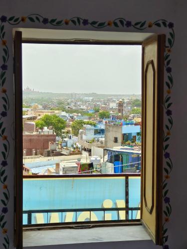 a view of a city from a window at Hill View in Jodhpur
