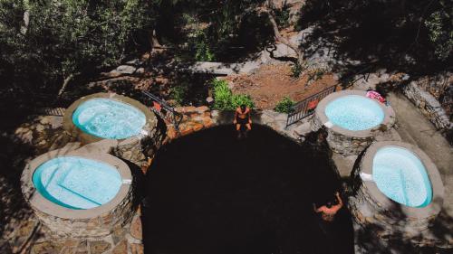 an overhead view of a person standing in a tunnel at The Baths Natural Hot Springs in Citrusdal
