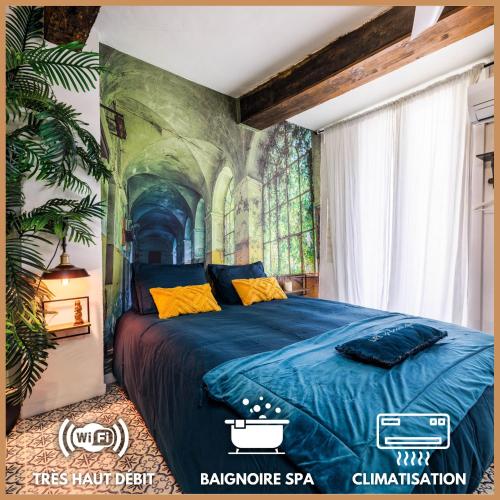 a bedroom with a bed with a painting on the wall at Youmi - Appartement Calme avec Jacuzzi et Clim à 5min de la Comédie, Tram à 200m in Montpellier