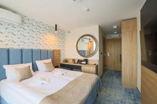 Postel nebo postele na pokoji v ubytování Porta Mare Active & Spa Resort