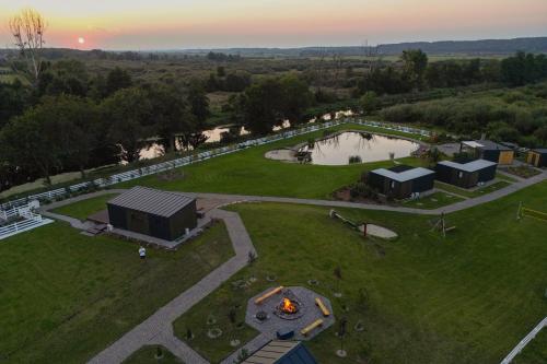an aerial view of a park with a pond at Lisi Ogon zanurzeni w naturze in Lisi Ogon