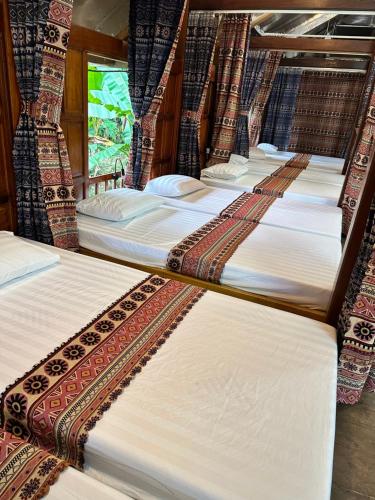 a row of beds on a train at Ha Giang Loop Legends in Lan Hung