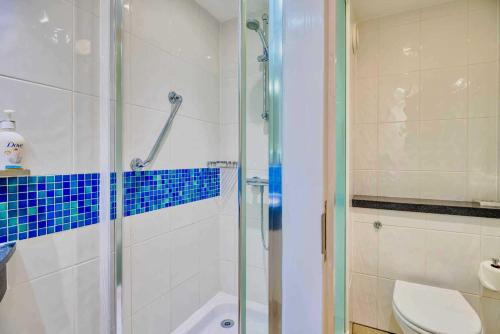 a bathroom with a shower and a toilet at Holiday Inn Express Hull City Centre by IHG in Hull