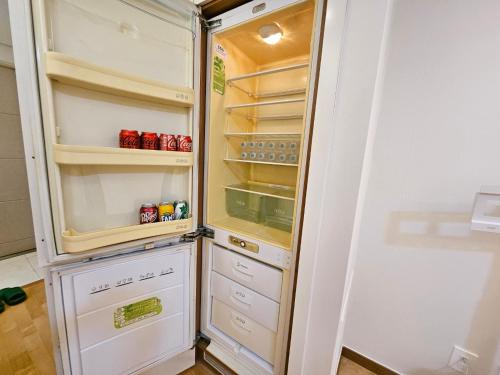 a white refrigerator with its door open at Gangnam Yeoksam Station Full-option Remodeling New House in Seoul