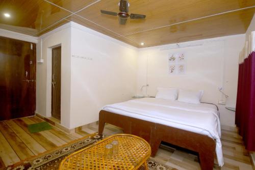 Ένα ή περισσότερα κρεβάτια σε δωμάτιο στο Tribal Wood Resort