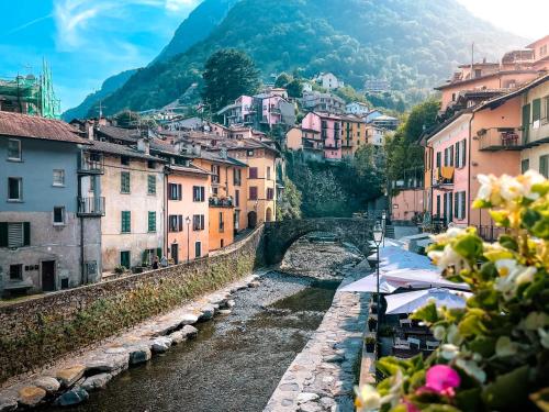 a view of a town with a river and buildings at Villa Celeste Argegno - Lake Como in Argegno
