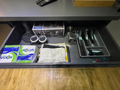 a drawer in a counter withtools and other items at TULUM luxury suites-SKOPJE in Skopje