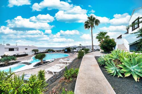 Casa Cris - Beach House next to Playa Grande By Lanzarote Vacation Homes