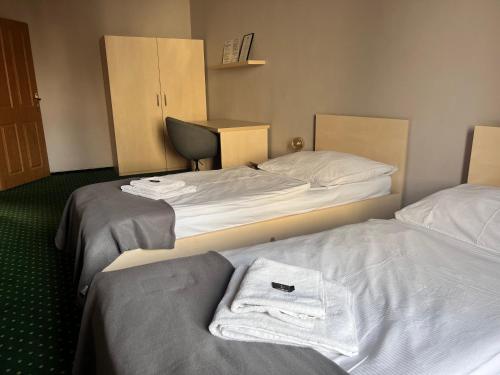 Postel nebo postele na pokoji v ubytování Pension U Jakuba
