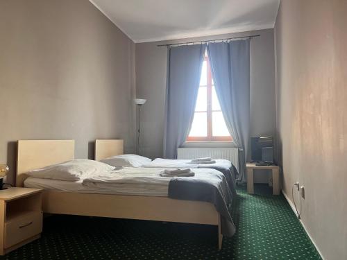 Postel nebo postele na pokoji v ubytování Pension U Jakuba