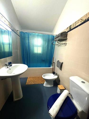 a bathroom with a sink and a toilet and a shower at Suite Bela Vigia 3 in Jardim do Mar