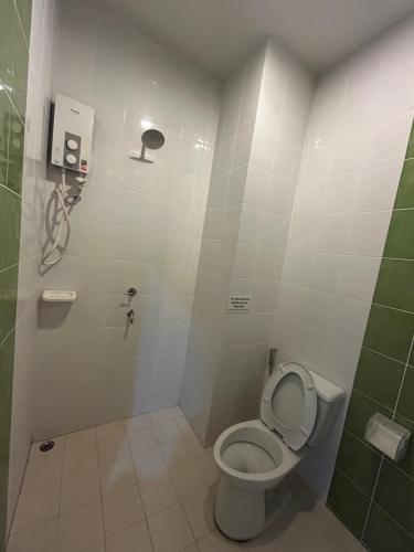 a bathroom with a toilet and a shower at FairHouse khaolak in Khao Lak
