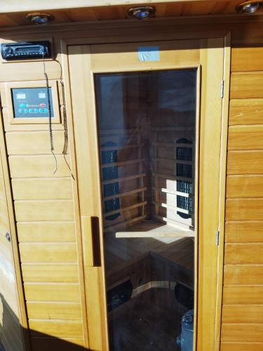 a glass door of an rv with a window at 5 izbový samostatný stojaci rodinný dom s podkrovím a veľkou záhradou so sezónnym bazénom, celoročnou saunou a vírivkou, privátny wellness in Topoľníky