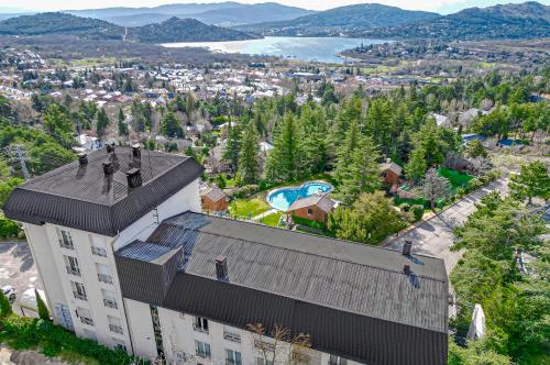 an overhead view of a building with birds on the roof at Hotel Hita "Nature Experience" for all in Navacerrada