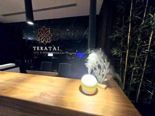 a table with a cup with smoke coming out of it at Exclusive 2 Bedroom Apartment in Grand Sapphire Resort Iskele in Iskele