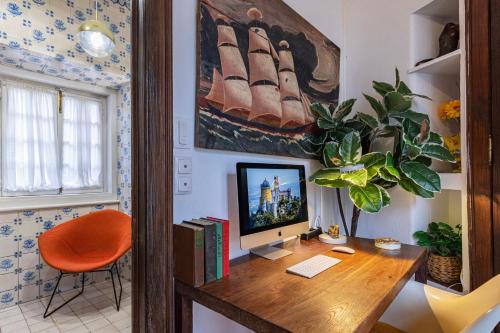 a home office with a desk with a computer on it at 17th Century Room in Villa with Snooker & HotTub - Sintra WOW in Sintra