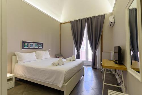 A bed or beds in a room at Felt in love in Catania
